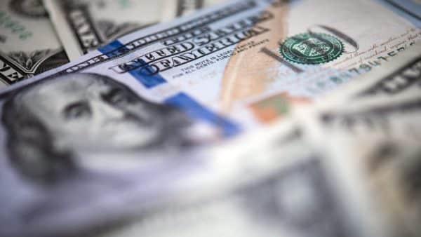 Close-up of a pile of U.S. $100 bills.